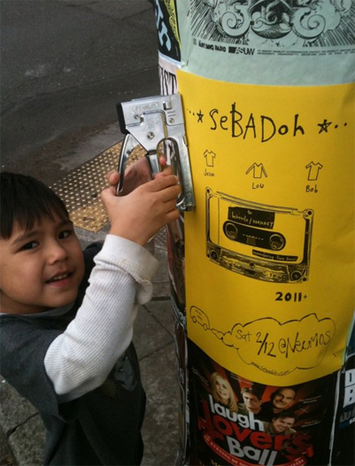 Mucho puts up Sebadoh posters, Carlos Valdez photo